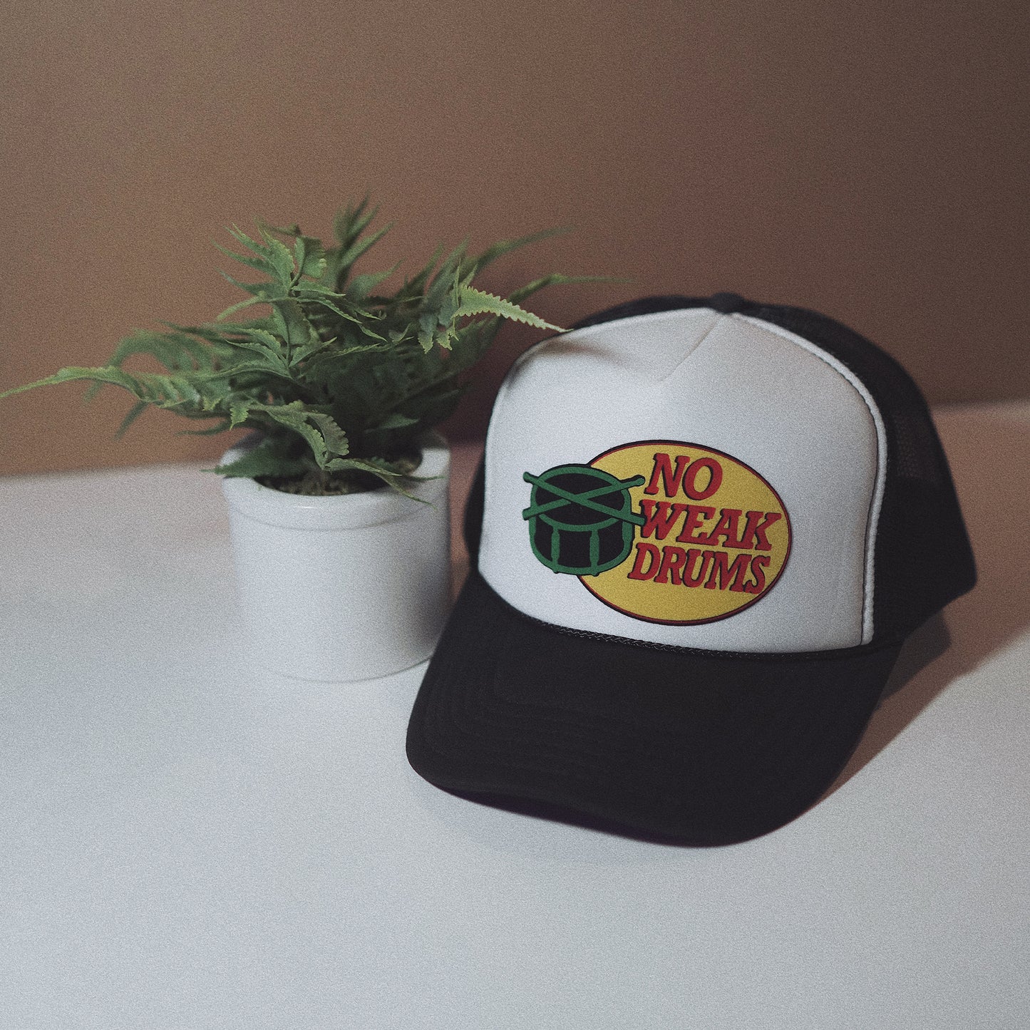 NO WEAK DRUMS TRUCKER HAT